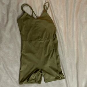A green one piece jump suit